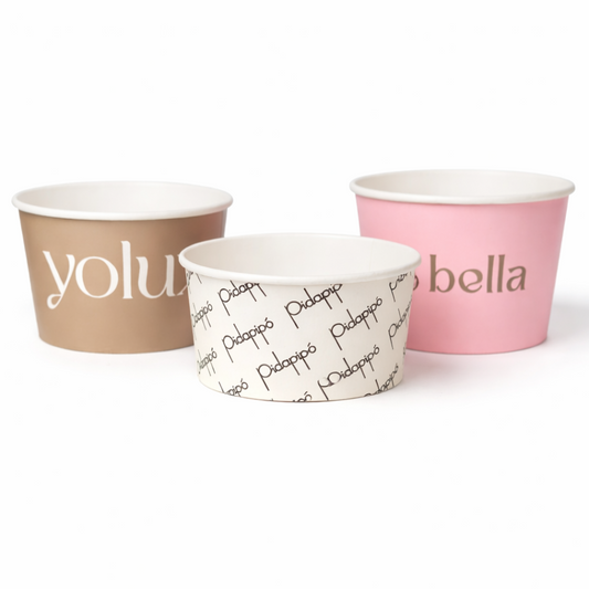 Custom printed ice cream cups in beige, white, and pink with branded text on a white background - Custom packaging by Exposurepack
