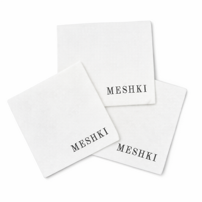 White Custom Napkins with 'MESHKI' branding on a white background