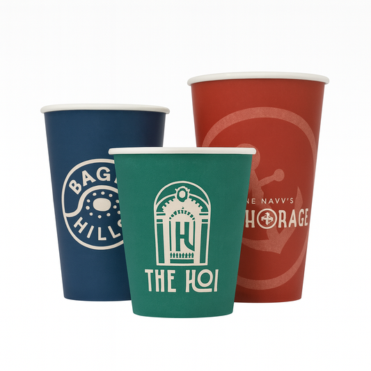 Three custom paper cups with branded designs on a white background - Custom packaging by Exposurepack